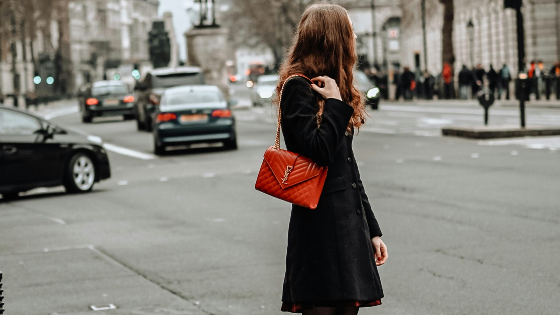 GK Concierge AI stylist — editorial portrait with handbag